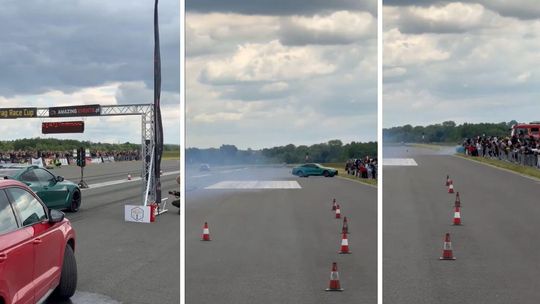 zdjęcie przedstawia zielony samochód jadący po torze
