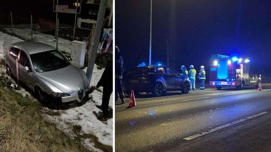 zdjęcie przedstawia samochód stojący w rowie, obok strażacy