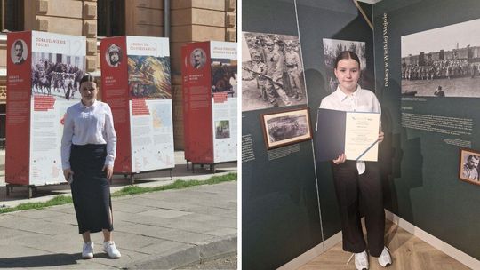 zdjęcie przedstawia dziewczynę stojącą na chodniku w tle obrazy