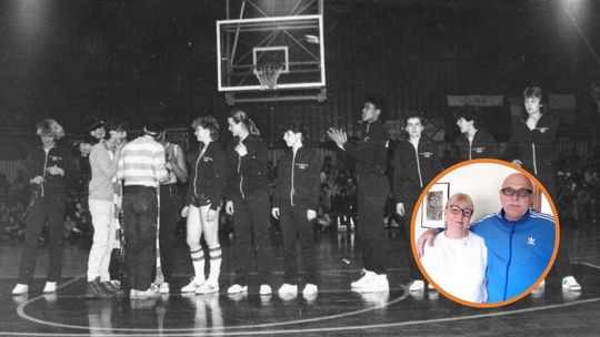 zdjęcie przedstawia kobietę i mężczyznę w pokoju, w tle stojąca grupa kobiet w hali sportowej w Gorlicach