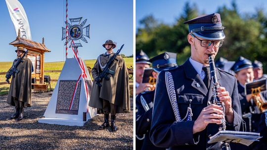 Zdjęcie przedstawia monument i trębacza grającego na trąbce