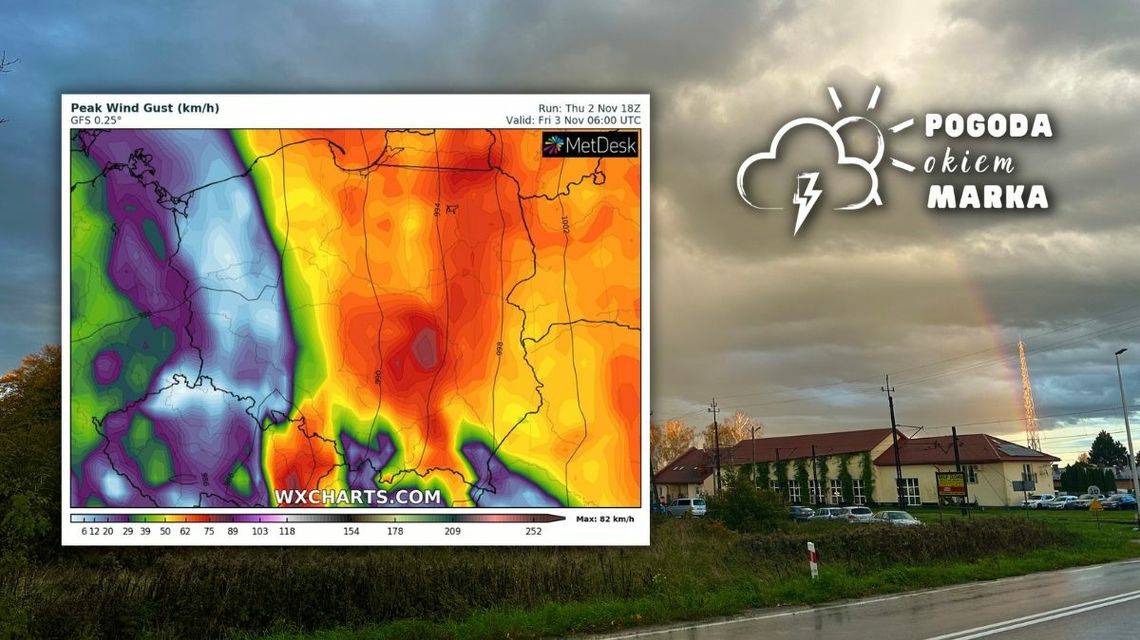 Niebo nad Gorlicami-Zagórzanami stacją kolejową, w tle budynki i tęcza