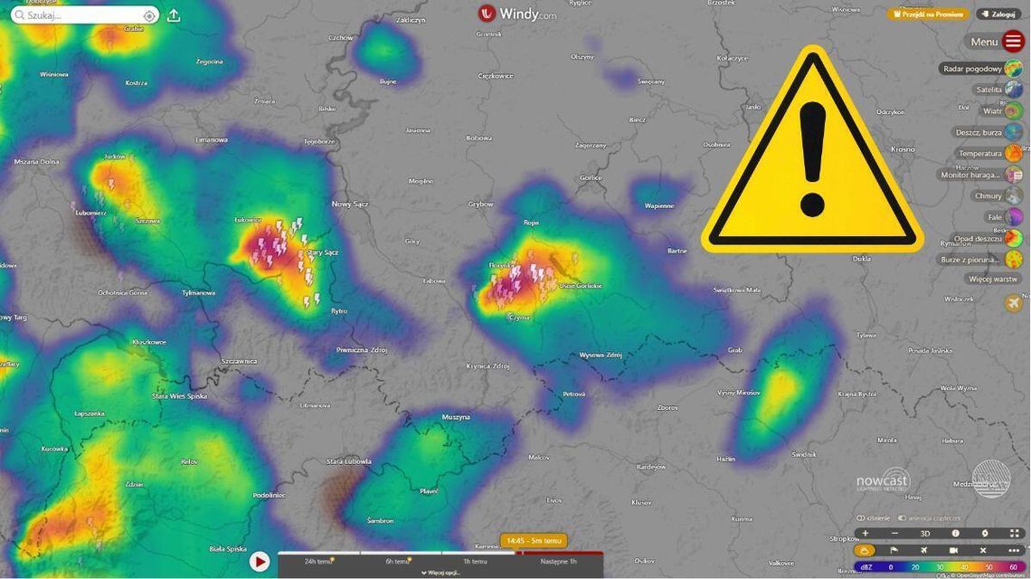 mapa pogody z oznaczonym terenem gdzie występuje burza w powiecie  gorlickim, obok czarny wykrzyknik na zółtym trójkącie